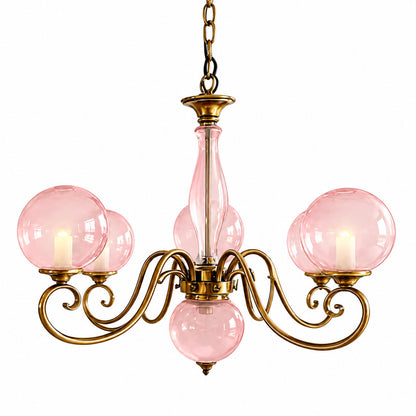 Six-light pink Boule glass chandelier over a larger dining table