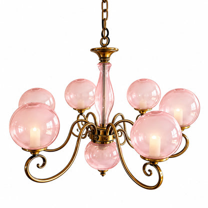 Seven-light pink Boule glass chandelier as a statement over a long dining table