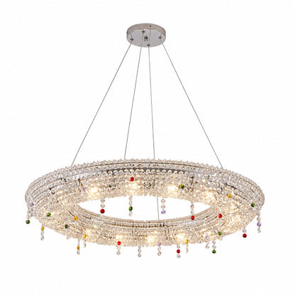 Oval 39.4-inch Brina crystal chandelier over a rectangular dining table