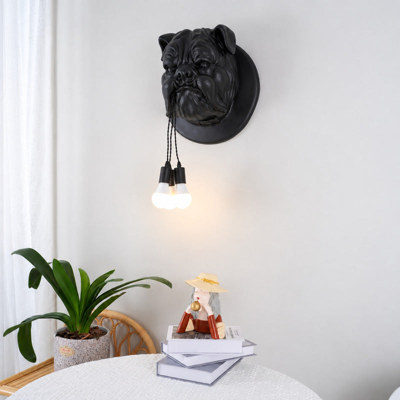 Bulldog wall sconce adding a quirky warm accent beside a reading chair