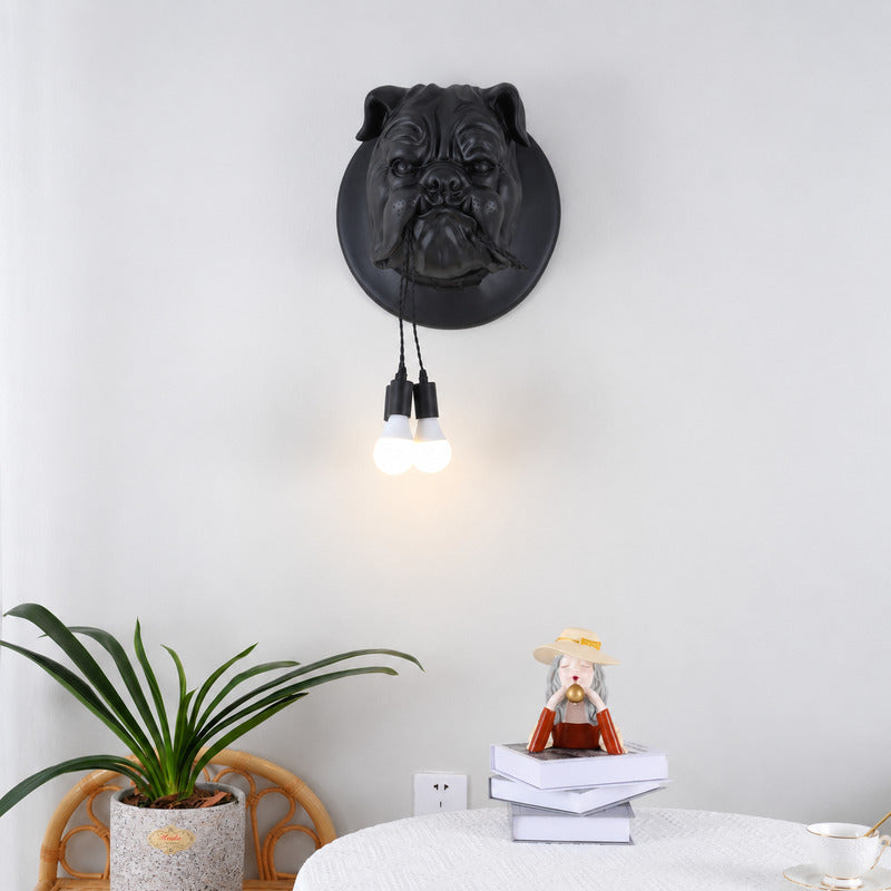 Bulldog wall sconce adding a quirky warm accent beside a reading chair