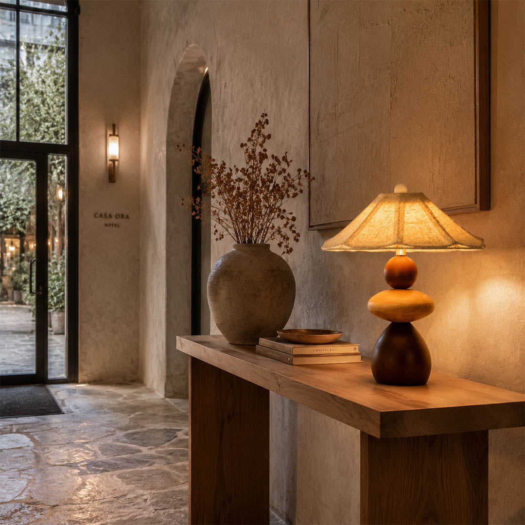 Cairn wood table lamp modern entryway console illuminated stacked wood linen shade warm American home lifestyle interior