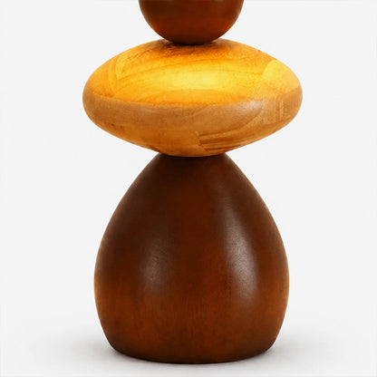 Cairn wood table lamp solid wood grain texture natural walnut tone detail close up craftsmanship organic