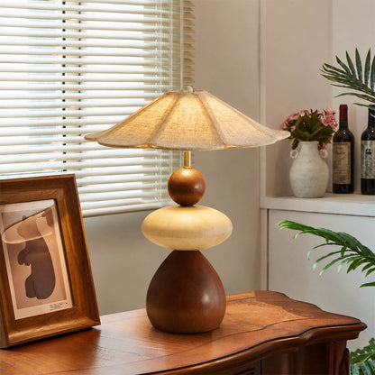 Cairn wood table lamp modern entryway console illuminated stacked wood linen shade warm American home lifestyle interior