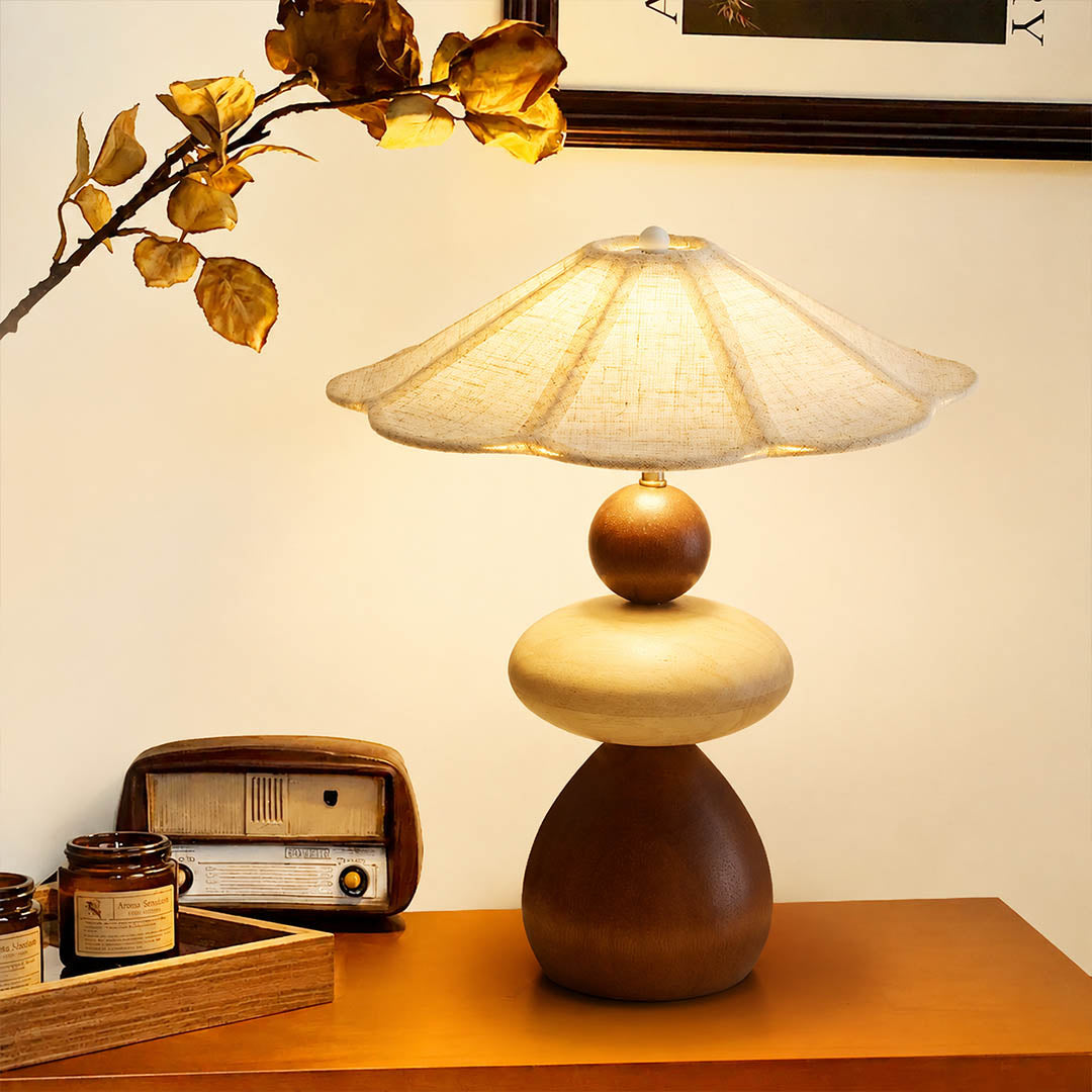 Cairn wood table lamp modern entryway console illuminated stacked wood linen shade warm American home lifestyle interior