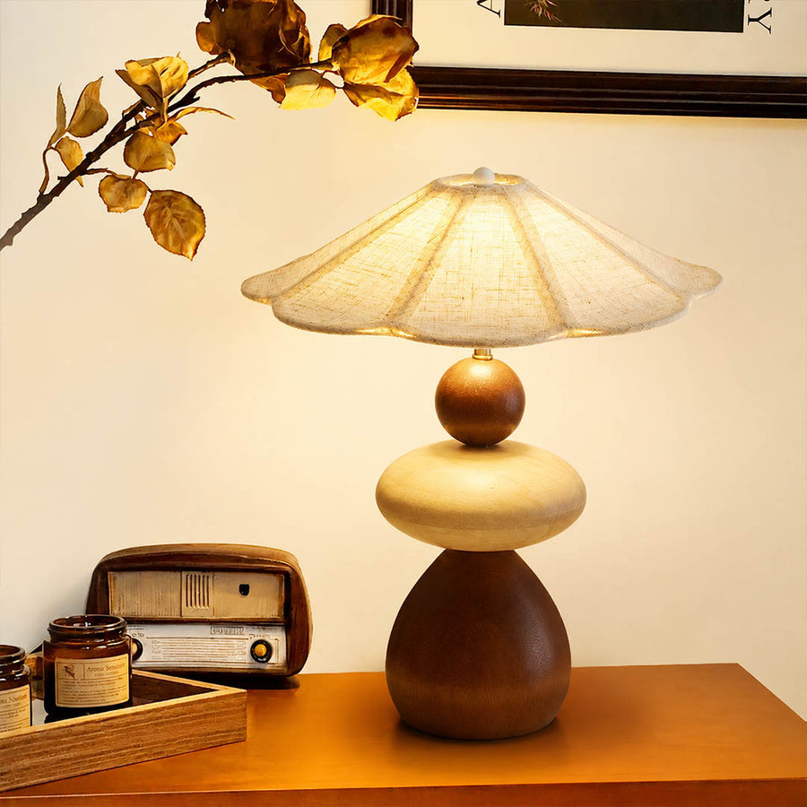 Cairn wood table lamp modern entryway console illuminated stacked wood linen shade warm American home lifestyle interior