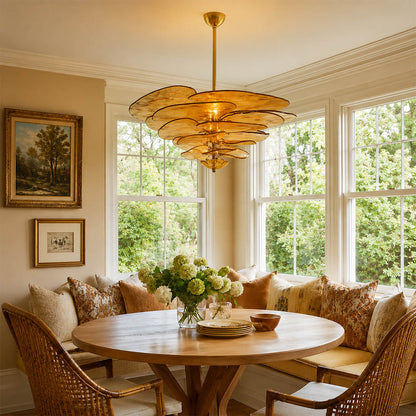 Calanthe medium 16 light amber Murano petal chandelier dining room walnut table cocktail bar art deco modern polished gold warm honey glow lifestyle interior