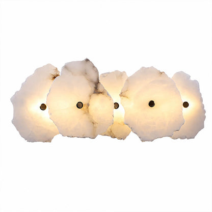 Calcaria alabaster wall light illuminated glowing veining warm soft radiance translucent stone detail close up quiet luxury