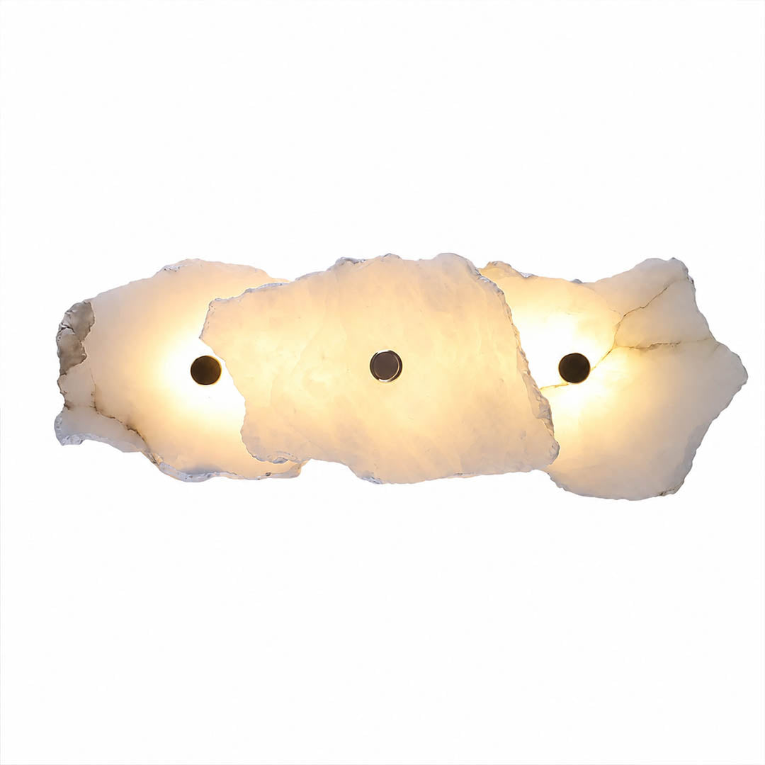 Calcaria alabaster wall light illuminated glowing veining warm soft radiance translucent stone detail close up quiet luxury