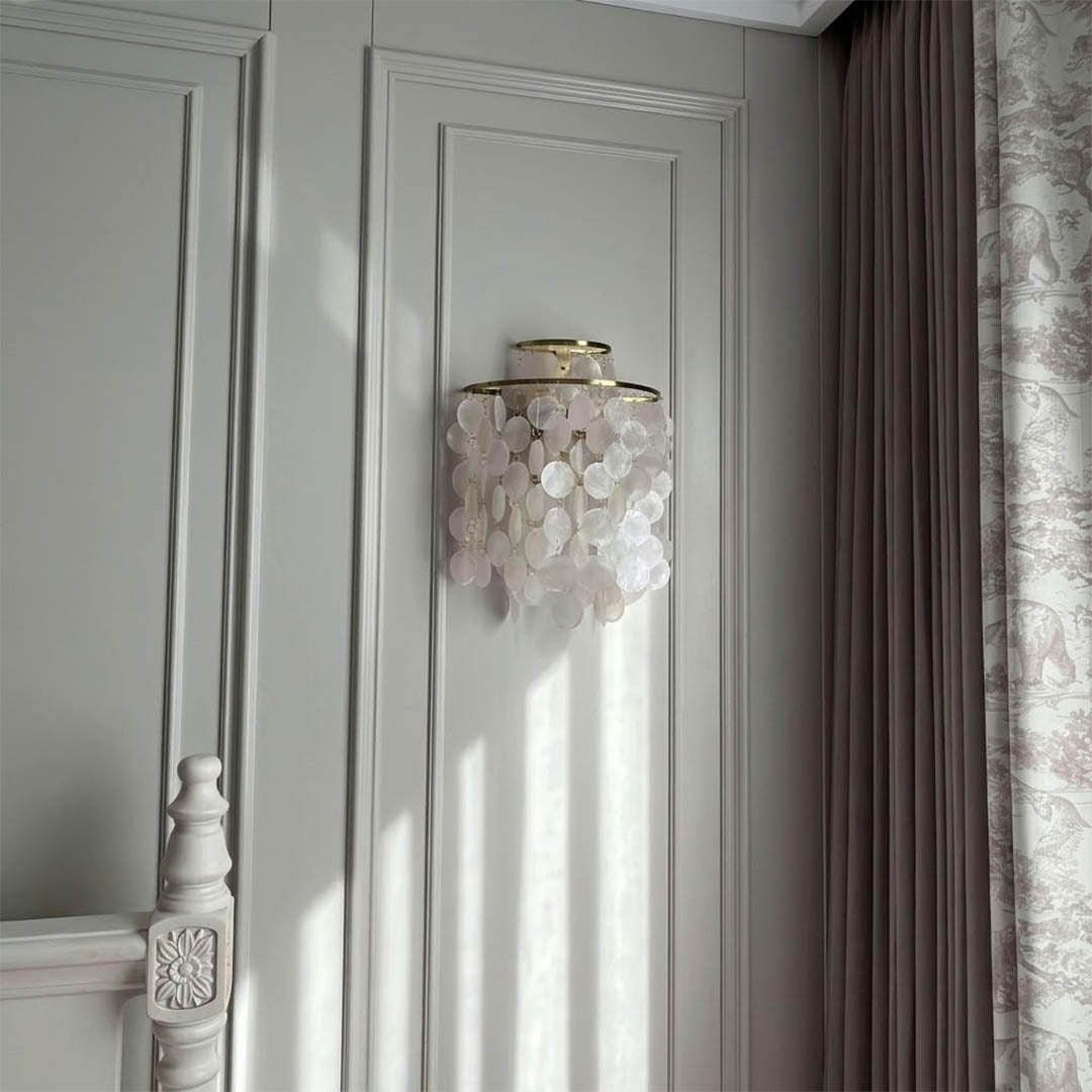Calia Gold 15 inch FUN WM style shell wall sconce staircase wall accent paired with Coralia chandelier coastal Mid Century designer warm glow lifestyle interior