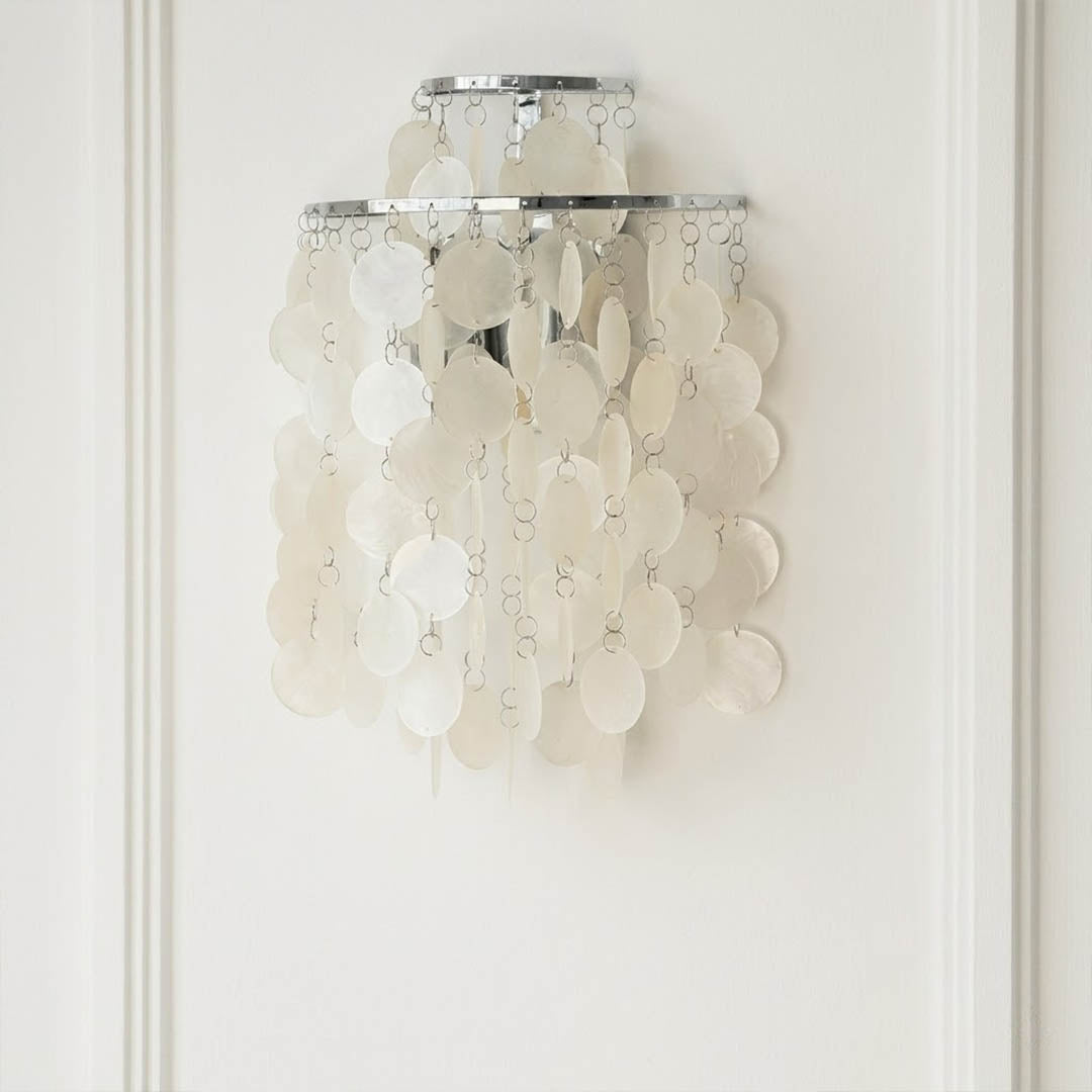 Calia Gold 15 inch FUN WM style shell wall sconce staircase wall accent paired with Coralia chandelier coastal Mid Century designer warm glow lifestyle interior