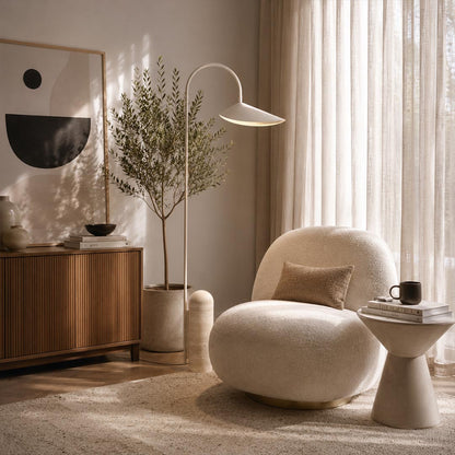 Calla floor lamp beige reading corner beside armchair adjustable calla lily shade warm cozy marble base American home lifestyle interior