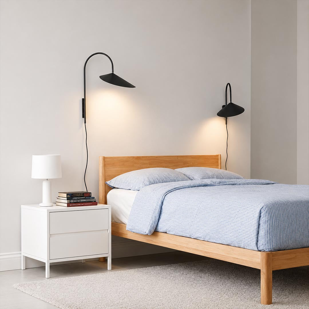 Calla plug-in wall sconce black pair mounted both sides bed headboard bedroom adjustable reading light marble base American home lifestyle interior