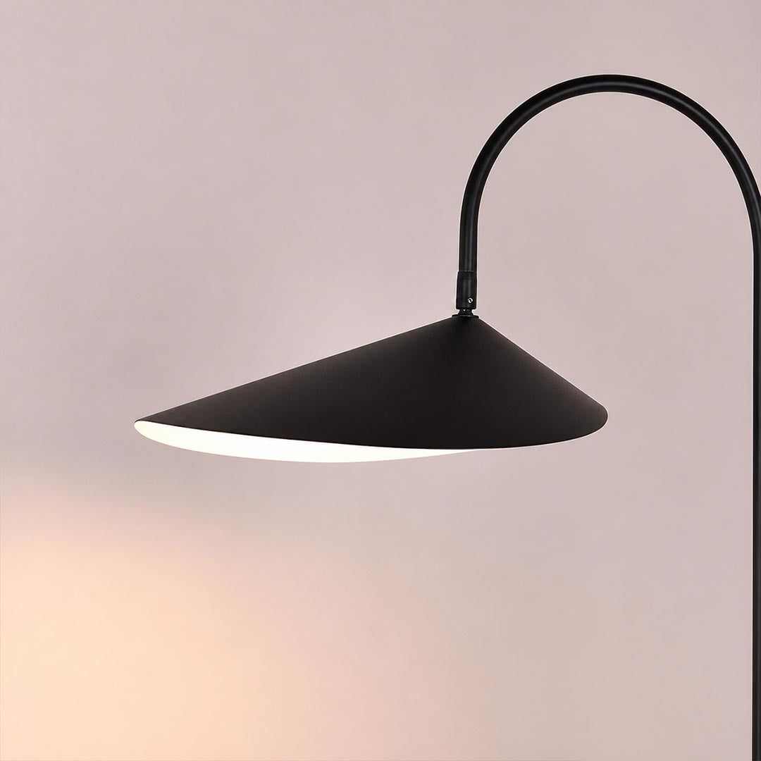 Calla table lamp illuminated warm soft ambient glow white painted interior petal shade evening cozy mood detail close up