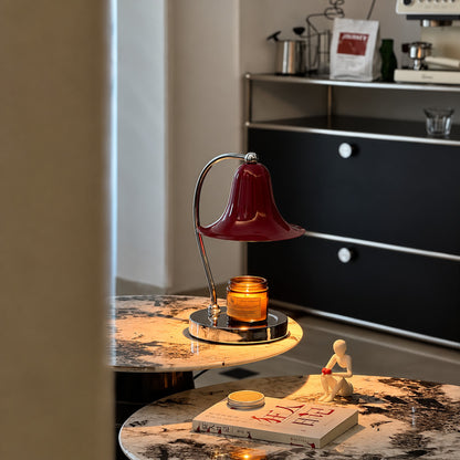 Campana candle warmer lamp as a flameless scent diffuser on a living room side table