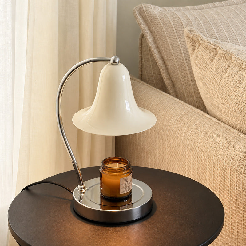 Campana candle warmer lamp as a flameless scent diffuser on a living room side table