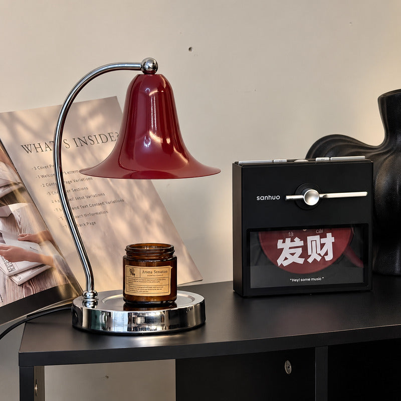 Campana candle warmer lamp creating a cozy scented atmosphere in a corner reading nook