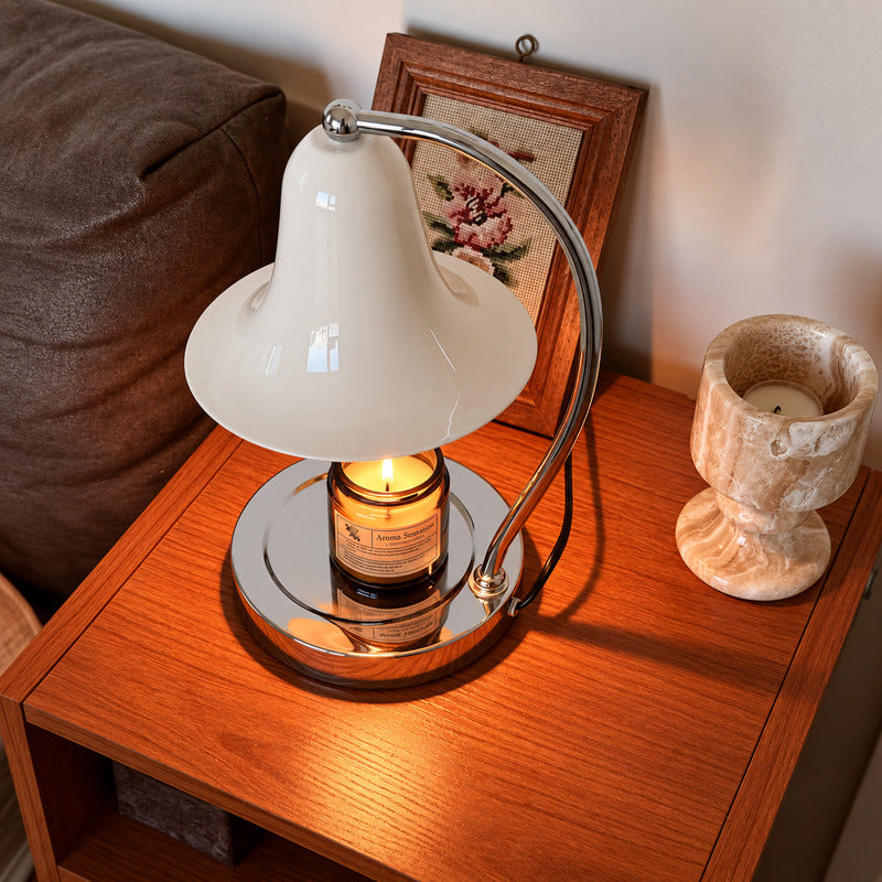 Campana candle warmer lamp creating a cozy scented atmosphere in a corner reading nook