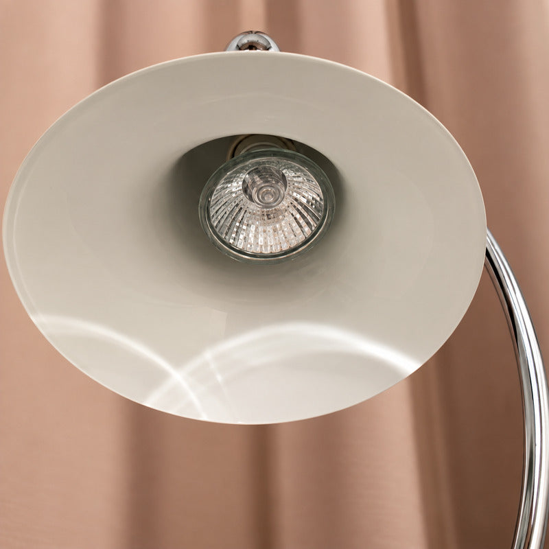 Close-up of the bell-shaped wrought-iron shade on the Campana candle warmer lamp
