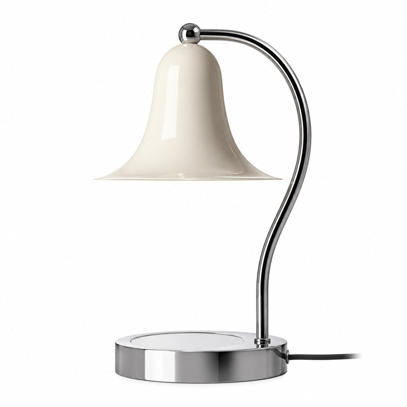 Campana candle warmer lamp with a cream bell-shaped shade melting a scented candle on a chrome base