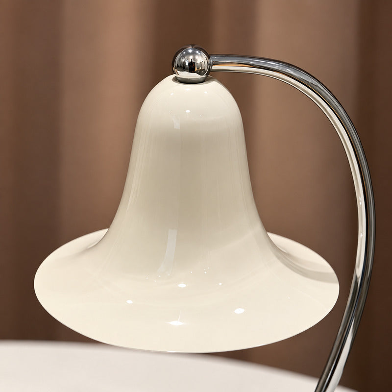 Close-up of the bell-shaped wrought-iron shade on the Campana candle warmer lamp