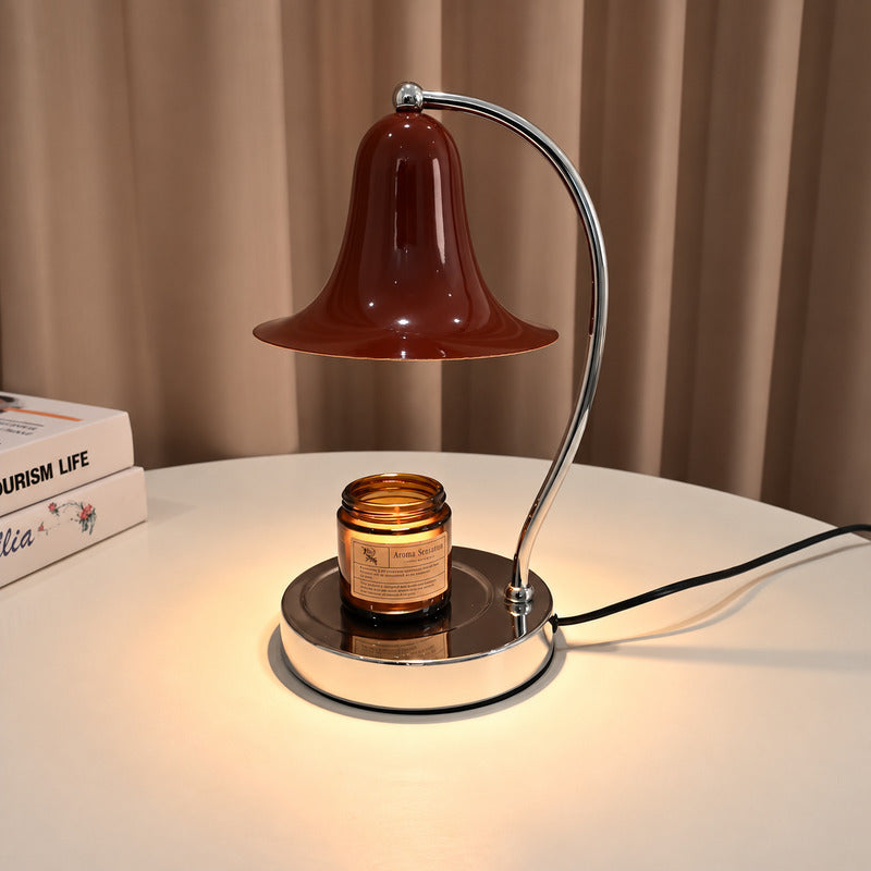 Campana candle warmer lamp melting a jar candle from above with a warm glow and no flame