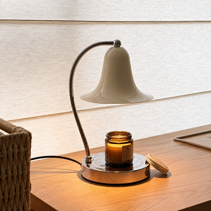 Campana candle warmer lamp warming a candle on a home office desk for a calming scent