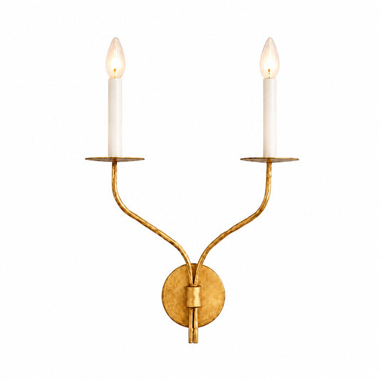 Candela wall sconce aged brass two light candle style curved arms exposed bulb vintage white background