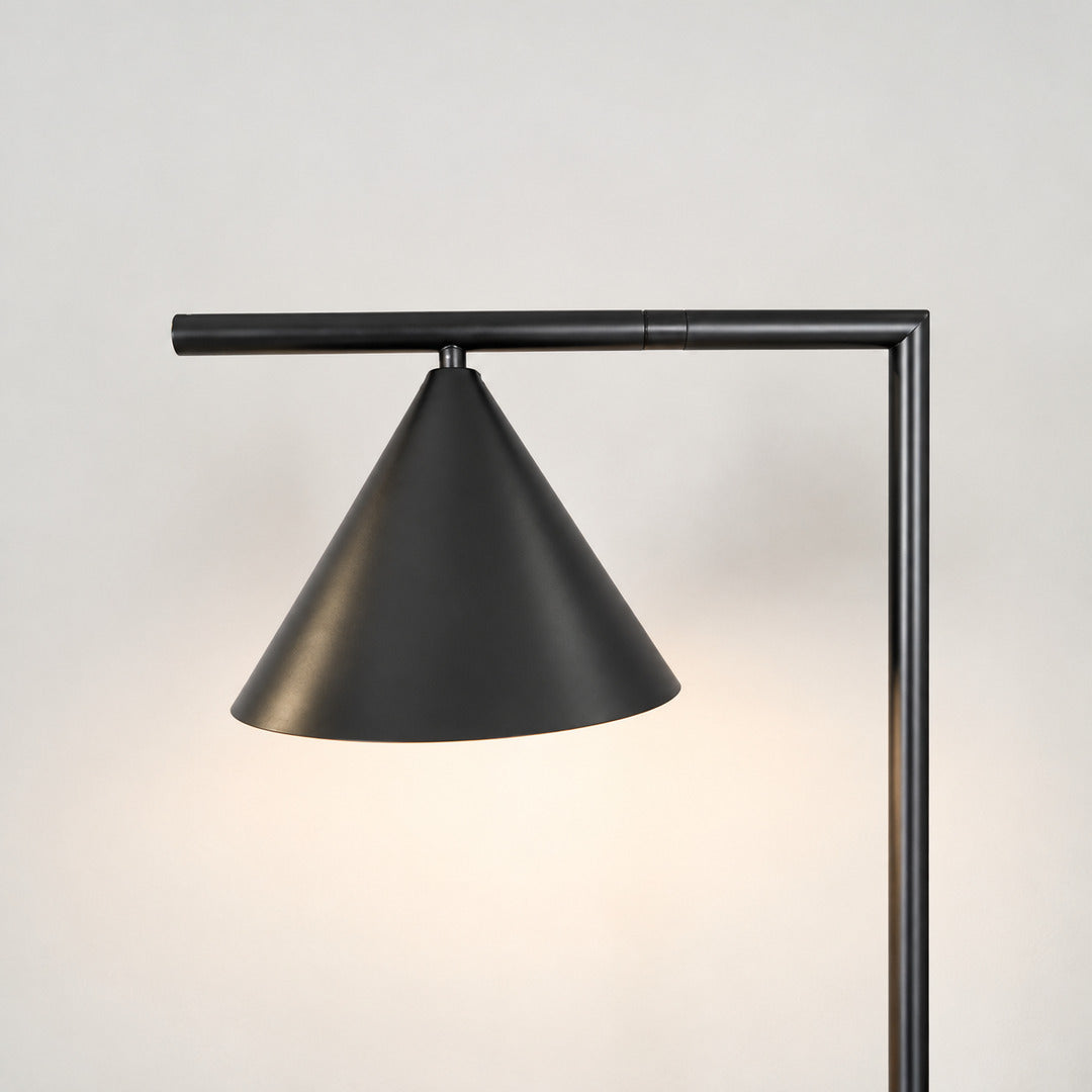 Close-up of the spinning opal cone shade on the Girevole floor lamp rotating to direct light
