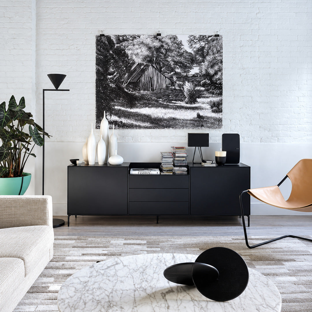 Girevole marble floor lamp filling a living room corner with a warm directed glow