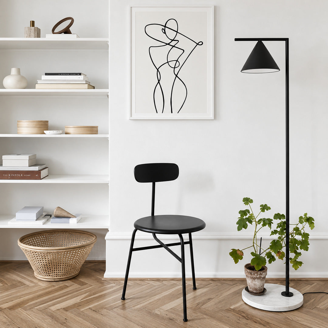 Girevole marble floor lamp filling a living room corner with a warm directed glow