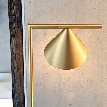 Close-up of the spinning opal cone shade on the Girevole floor lamp rotating to direct light