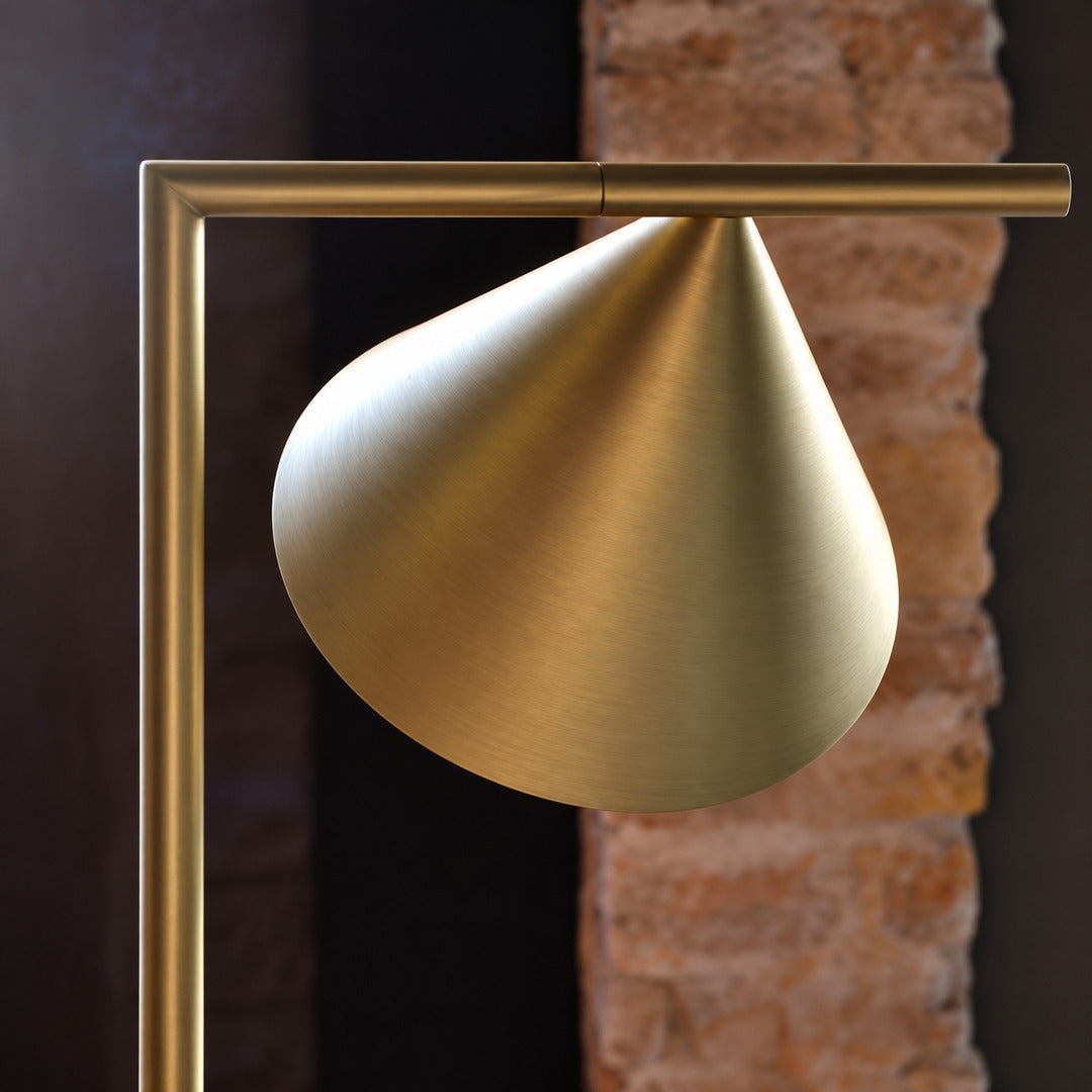 Girevole marble floor lamp shown with the cone shade rotated to different angles for directed light