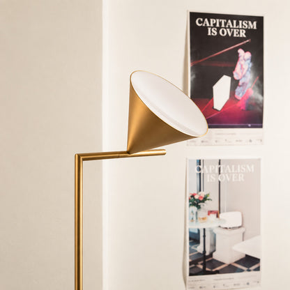 Close-up of the spinning opal cone shade on the Girevole floor lamp rotating to direct light