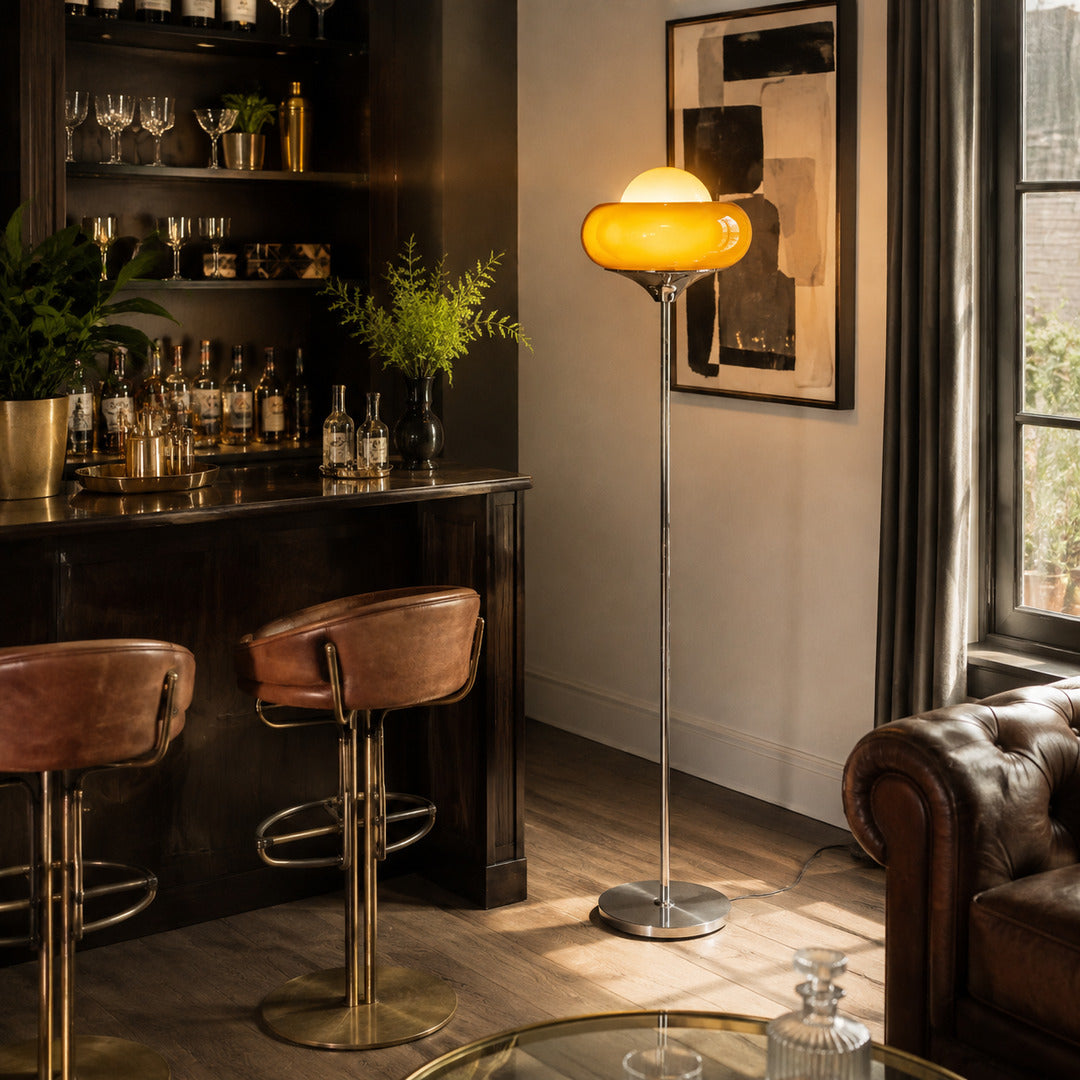 Caramella floor lamp illuminated evening retro warm caramel amber glowing glass globe chrome moody cozy American home lifestyle interior