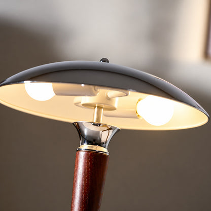 Close-up of the polished chrome helmet-shaped dome shade of the Casco table lamp