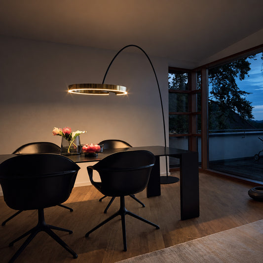 Warm evening glow of the floating ring of the Cerchio floor lamp creating a modern mood after dark