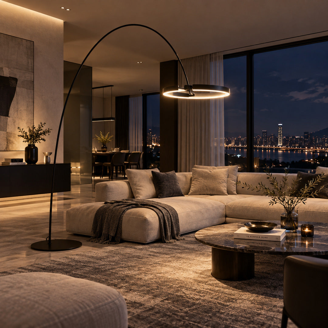 Cerchio halo ring floor lamp standing beside a sofa as a modern sculptural accent in a living room