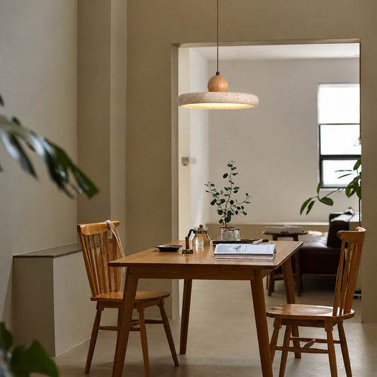 Cerchio travertine pendant light dining table warm glow travertine stone disc Japandi American home lifestyle interior styled