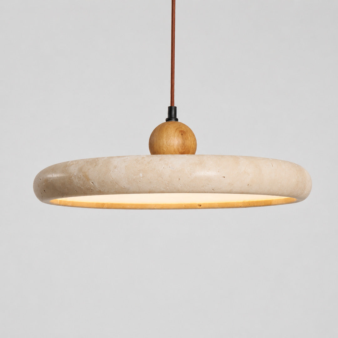 Cerchio travertine pendant light bottom diffuser warm downward glow detail close up