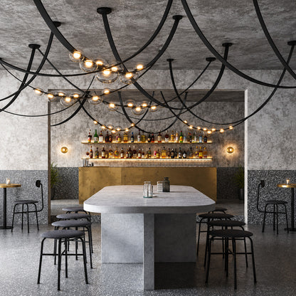 Cinghia leather arc chandeliers over long tables in an upscale restaurant