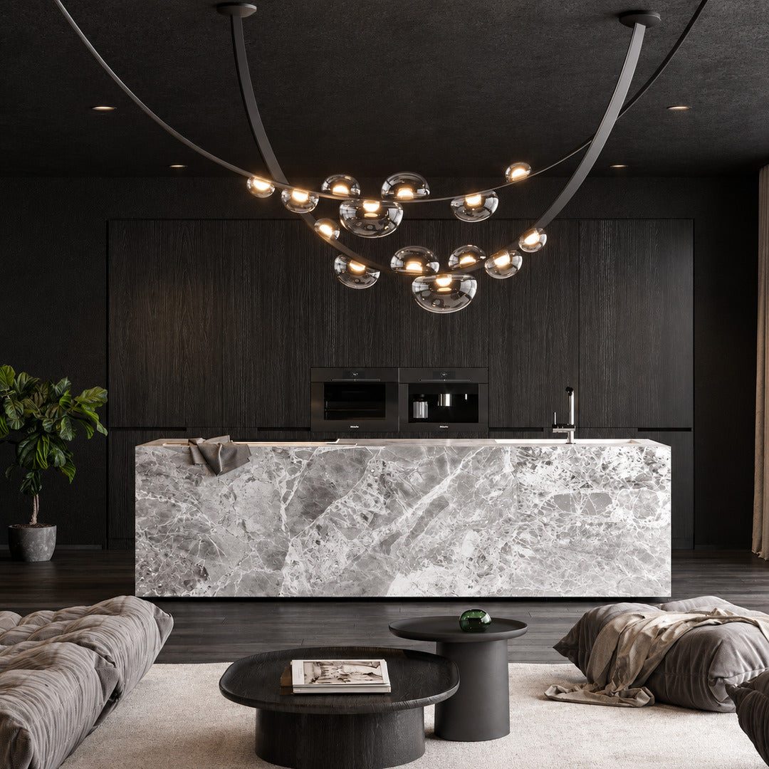 Cinghia leather arc chandelier as a linear focal point in a modern hotel lobby
