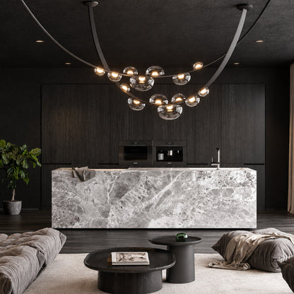 Cinghia leather arc chandelier as a linear focal point in a modern hotel lobby