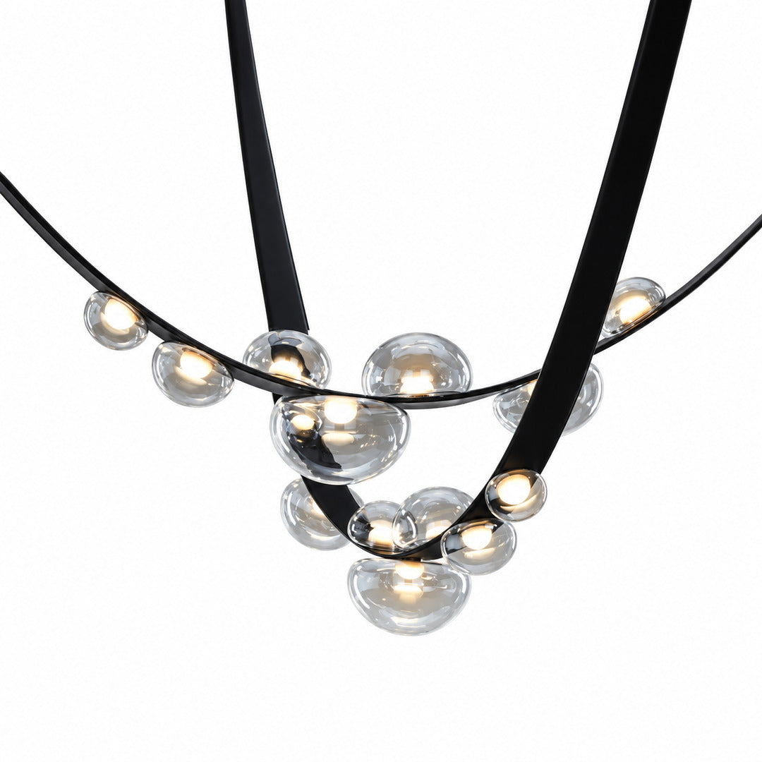 Close-up of the leather-wrapped metal arc of the Cinghia chandelier