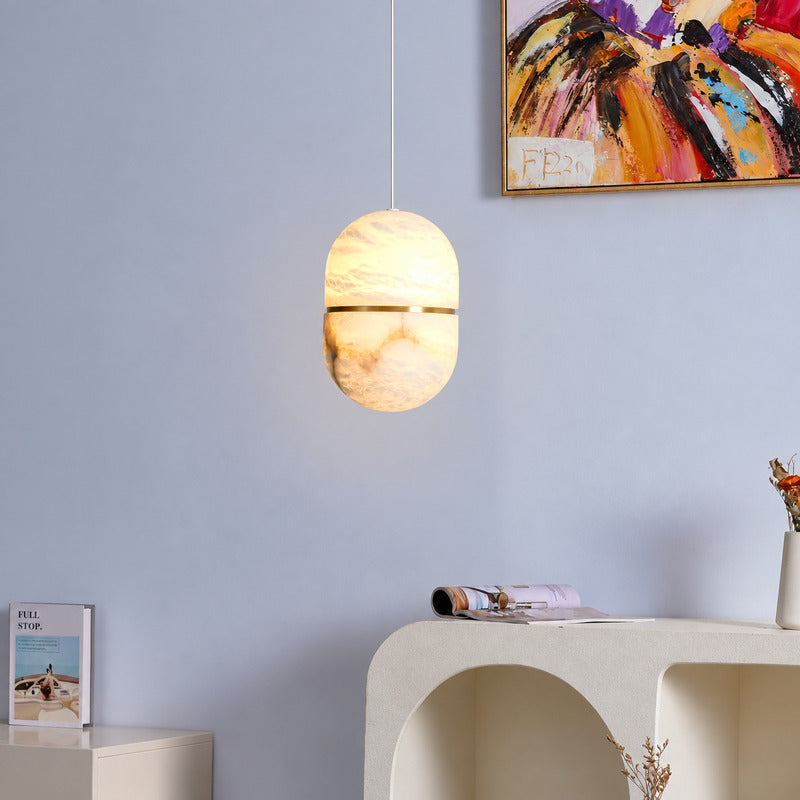 Ciotola alabaster pendant anchoring an organic modern interior with natural stone warmth