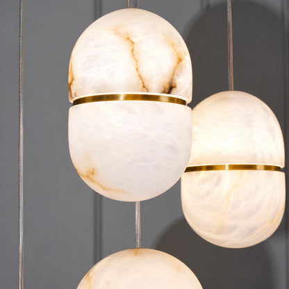 Natural veining and translucency of the alabaster shade on the Ciotola pendant, unique to each piece