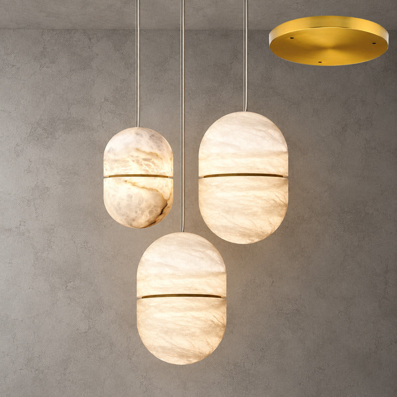 Three-light Ciotola alabaster pendant cascading over a dining table