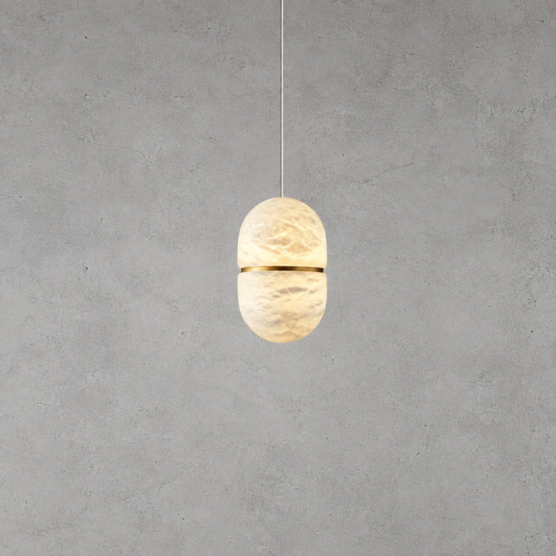 Small single Ciotola alabaster pendant over a breakfast nook or bedside table