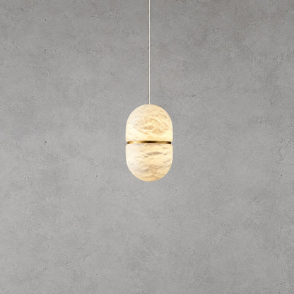 Small single Ciotola alabaster pendant over a breakfast nook or bedside table