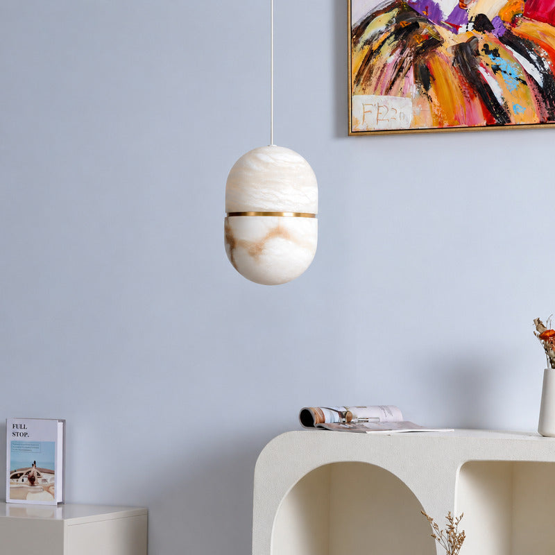 Gold Ciotola alabaster pendant highlighting a high-end retail showroom